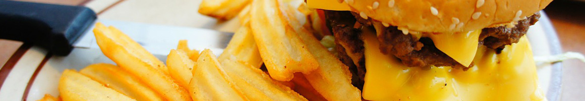 Eating Burger at Burger House Restaurant restaurant in Lancaster, KY.